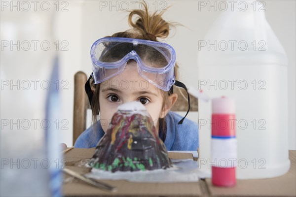 Girl making volcano