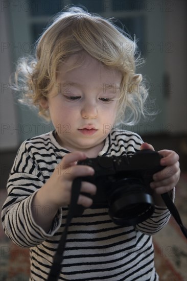 Boy holding camera