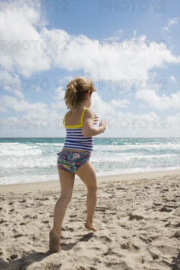 Girl running on beach