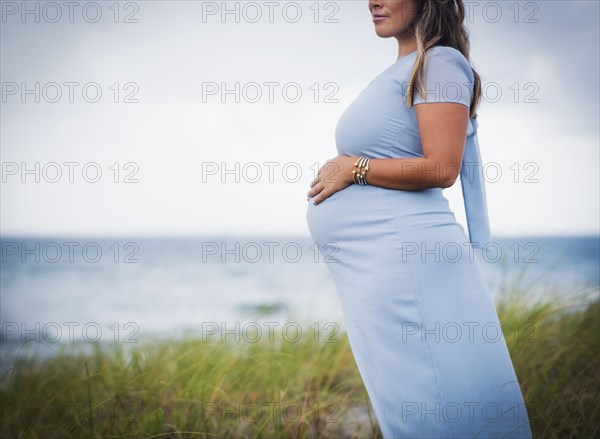 Pregnant woman wearing blue dress