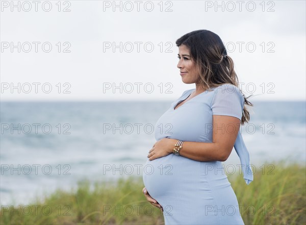 Pregnant woman wearing blue dress