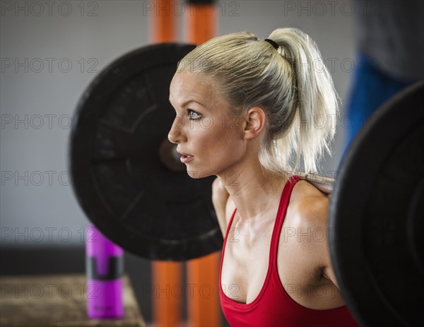 Young woman weight lifting