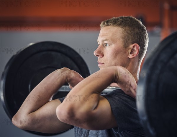 Young man weight lifting