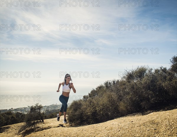 Woman jogging on mountain