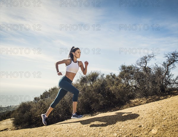 Woman jogging on mountain