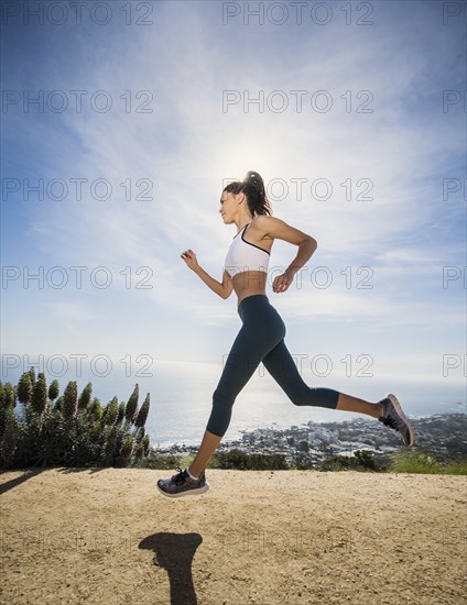 Woman jogging on mountain