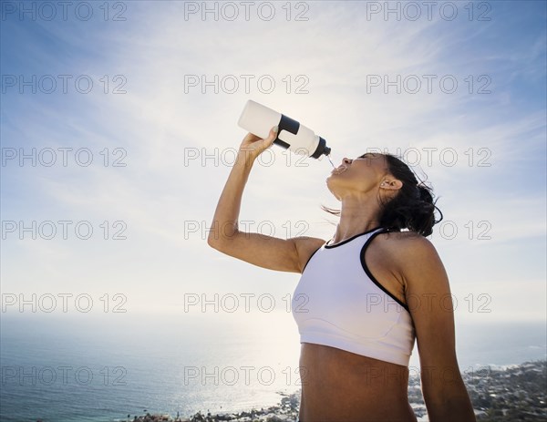 Woman drinking water from bottle