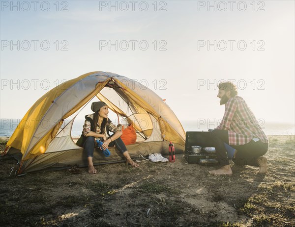 Couple camping on beach