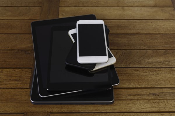 Stack of smart phones and digital tablets