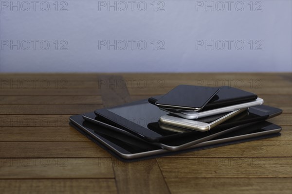 Stack of smart phones and digital tablets