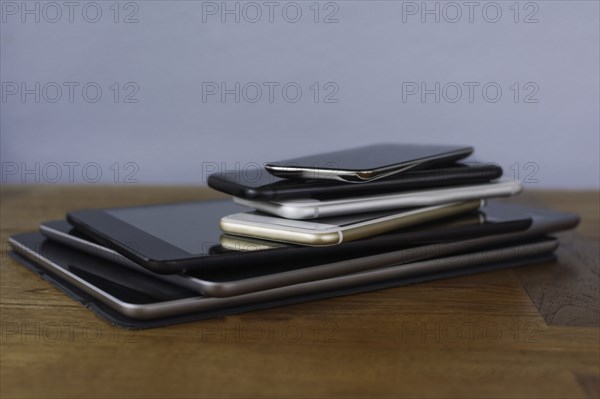 Stack of smart phones and digital tablets