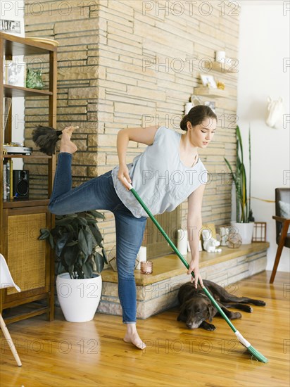 Woman sweeping and dusting