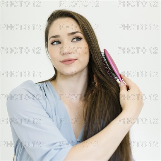 Woman brushing her hair