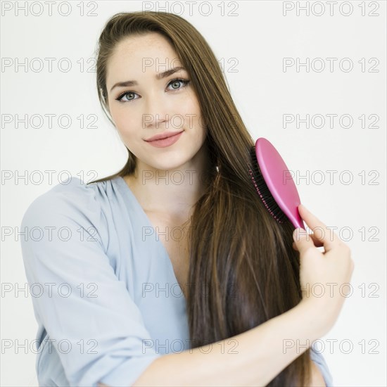 Woman brushing her hair