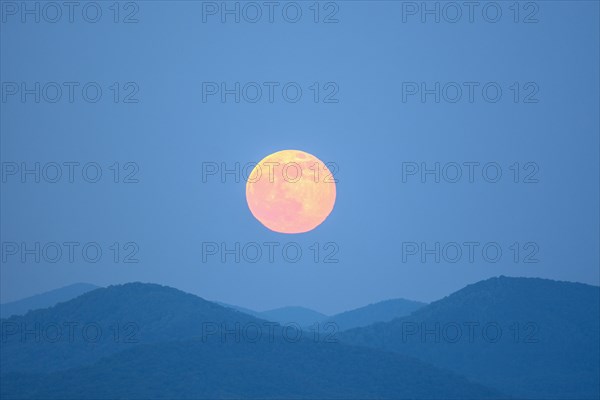 Full moon over Blue Ridge Mountains