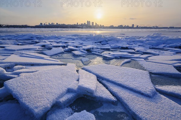 Ice on river at sunset