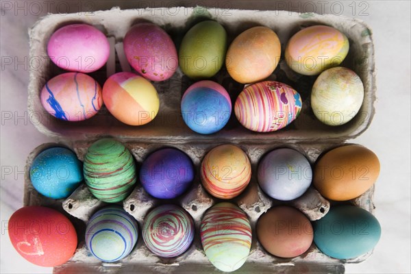 Dyed eggs in carton