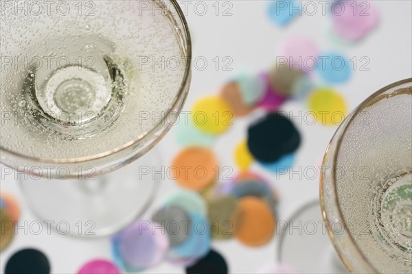 Cocktail glasses on confetti