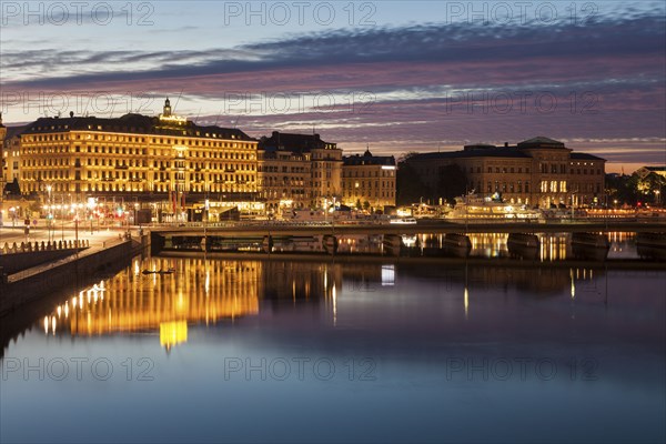 Buildings by river at sunset in Stockholm, Sweden