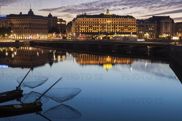 Buildings by river at sunset in Stockholm, Sweden