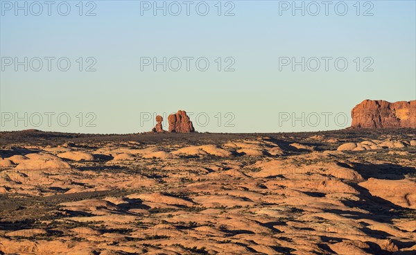 Sand dunes and Balanced Rock in Arches National Park, Utah, USA