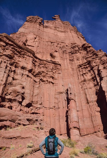 Woman standing by Fisher Towers in Utah, USA