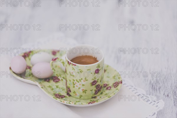 Eggs on floral plate with matching cup of tea