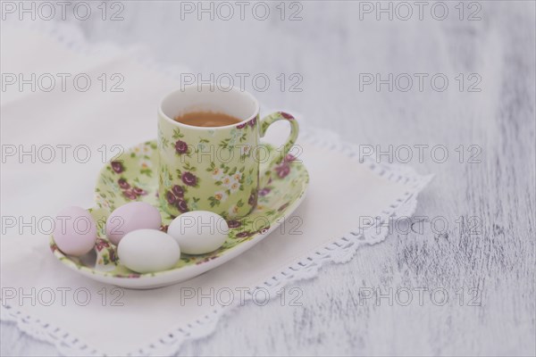 Eggs on floral plate with matching cup of tea