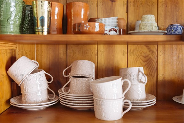 Tableware on wooden shelves