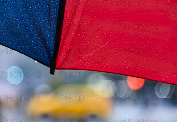 Close up of umbrella on rainy day