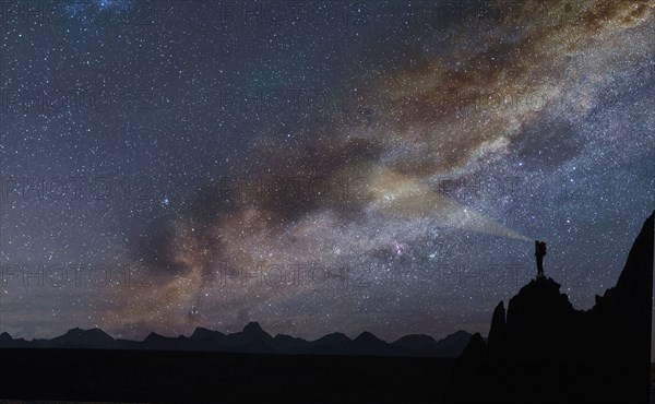 Silhouette of rocks under starscape in the Dolomites, South Tyrol, Italy