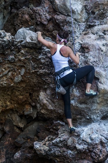 Woman rock climbing