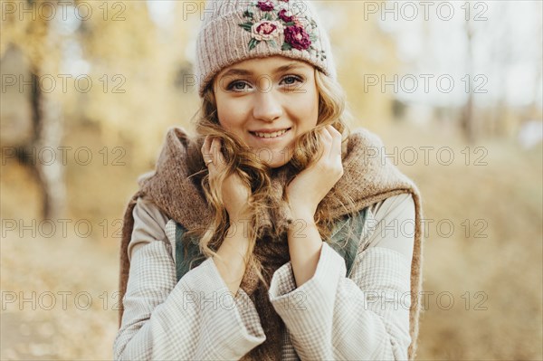 Young woman in floral pattern woolen hat