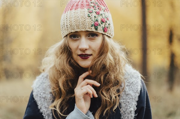 Young woman in floral pattern woolen hat