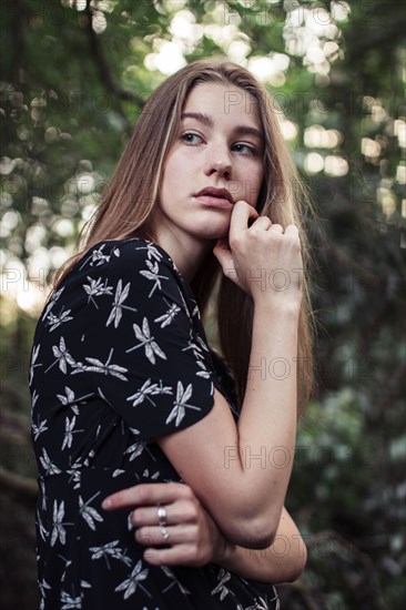 Young woman looking over shoulder