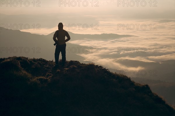Silhouette of man in the Carpathian Mountain Range at sunrise