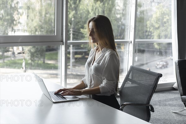 Young businesswoman working on laptop