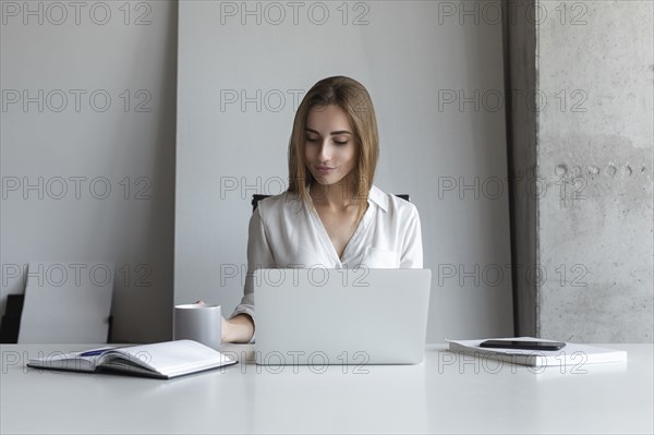 Young businesswoman working at desk