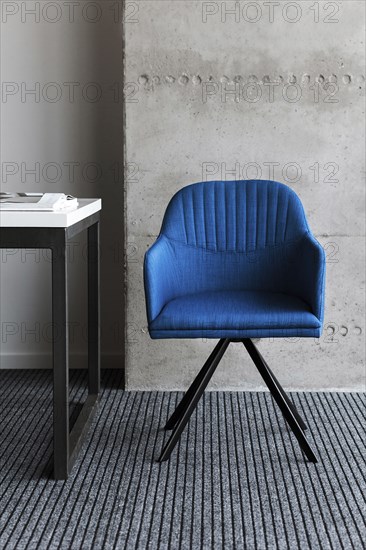 Blue chair by desk