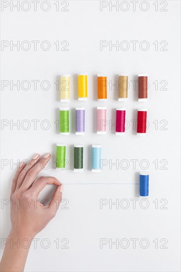 Woman's hand selecting thread