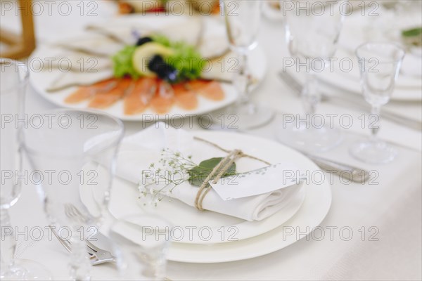 Wedding place setting with napkin on plate