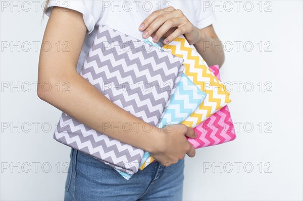 Woman holding colorful zigzag fabrics