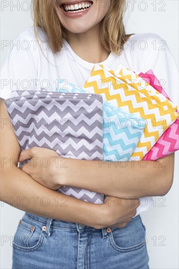 Woman holding colorful zigzag fabrics