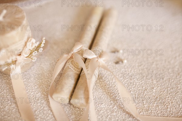 Candles tied by ribbon during wedding