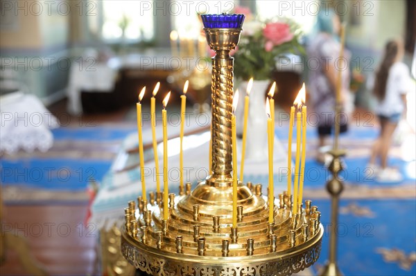 Candle holder in church during wedding