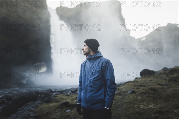 Hiker by Haifoss waterfall in Iceland