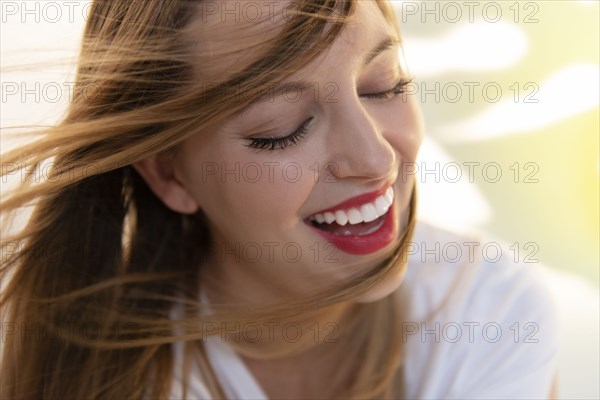 Portrait of windswept young woman wearing red lipstick