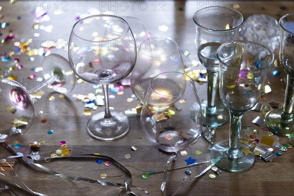 Empty wineglasses with confetti