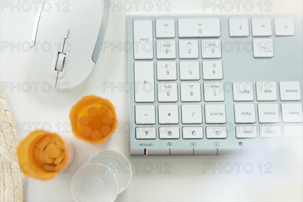 Open pill bottles by computer keyboard and mouse