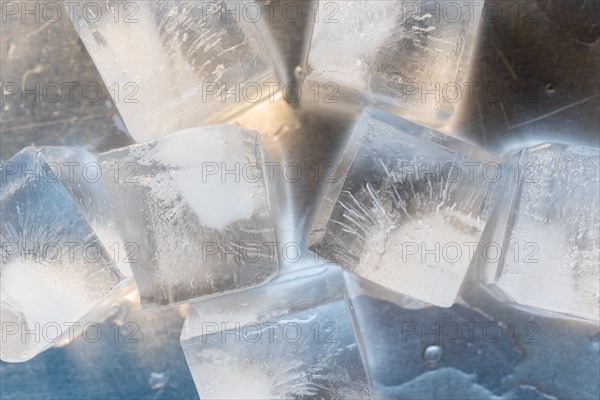 Ice cubes on silver surface